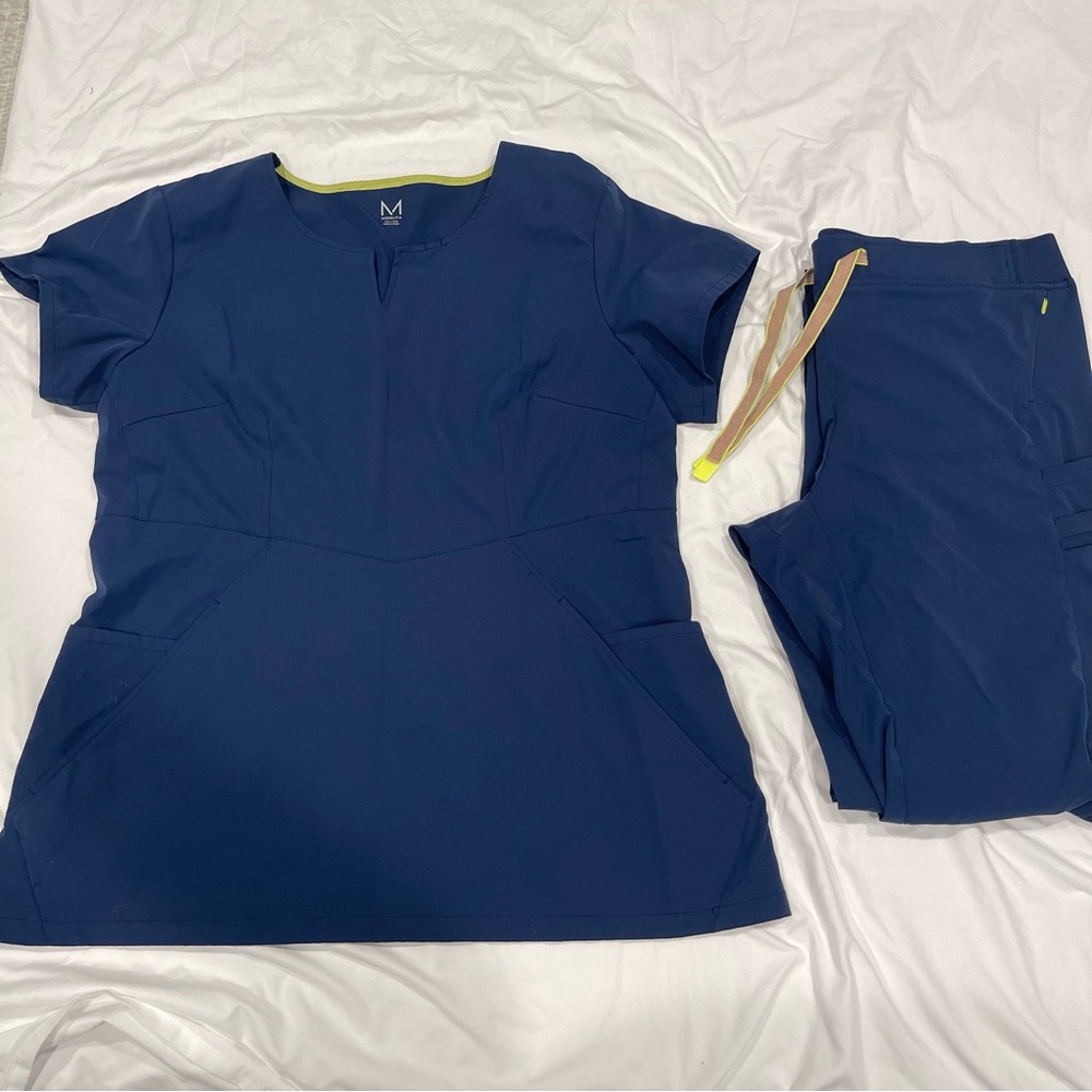 Blue Medelita scrub top and pants in a size XL.